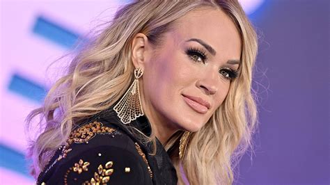 Carrie Underwood sizzles in red string bikini during break ...